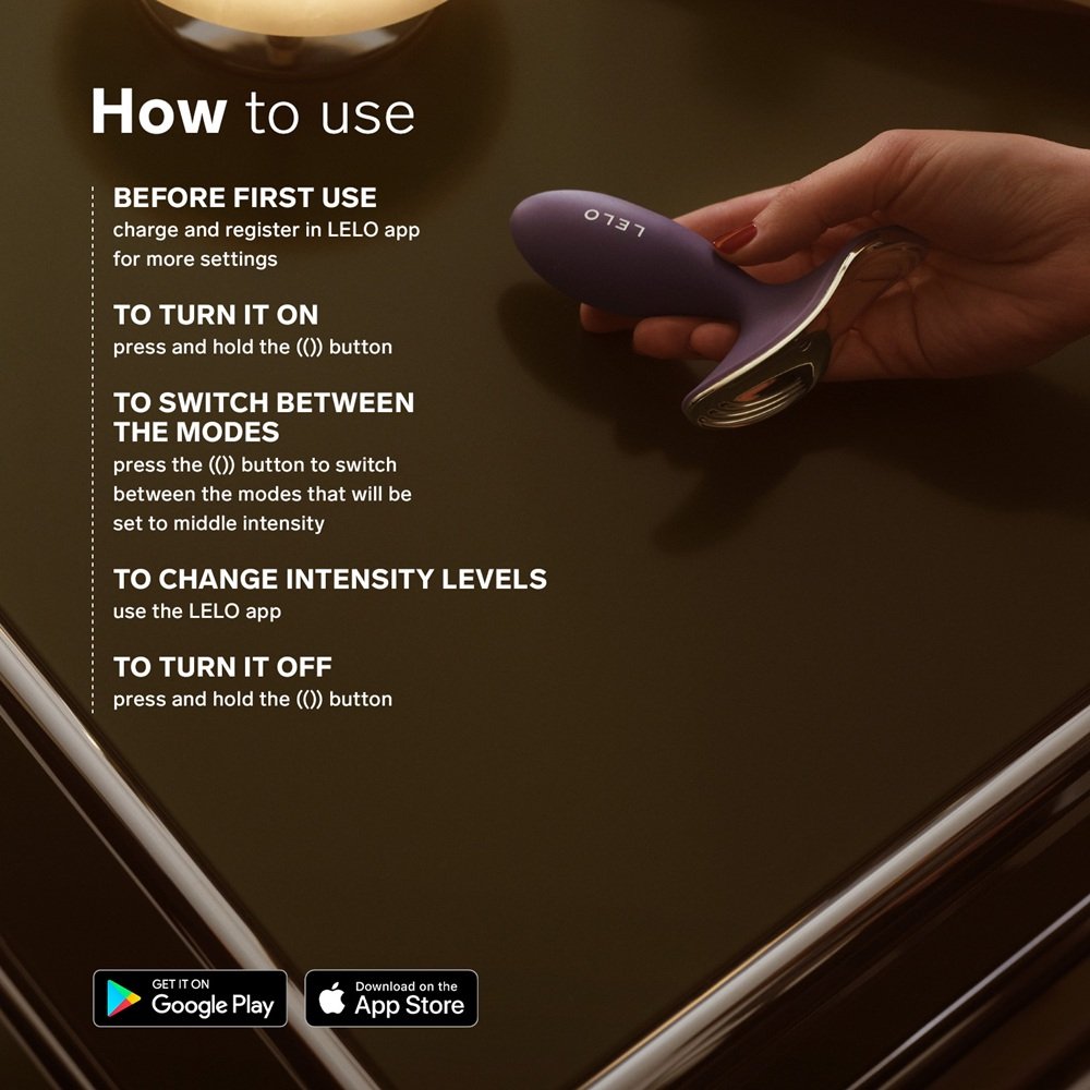 Hand holding LELO Surfer 2 unisex vibrating anal plug with instructions for use and app download icons