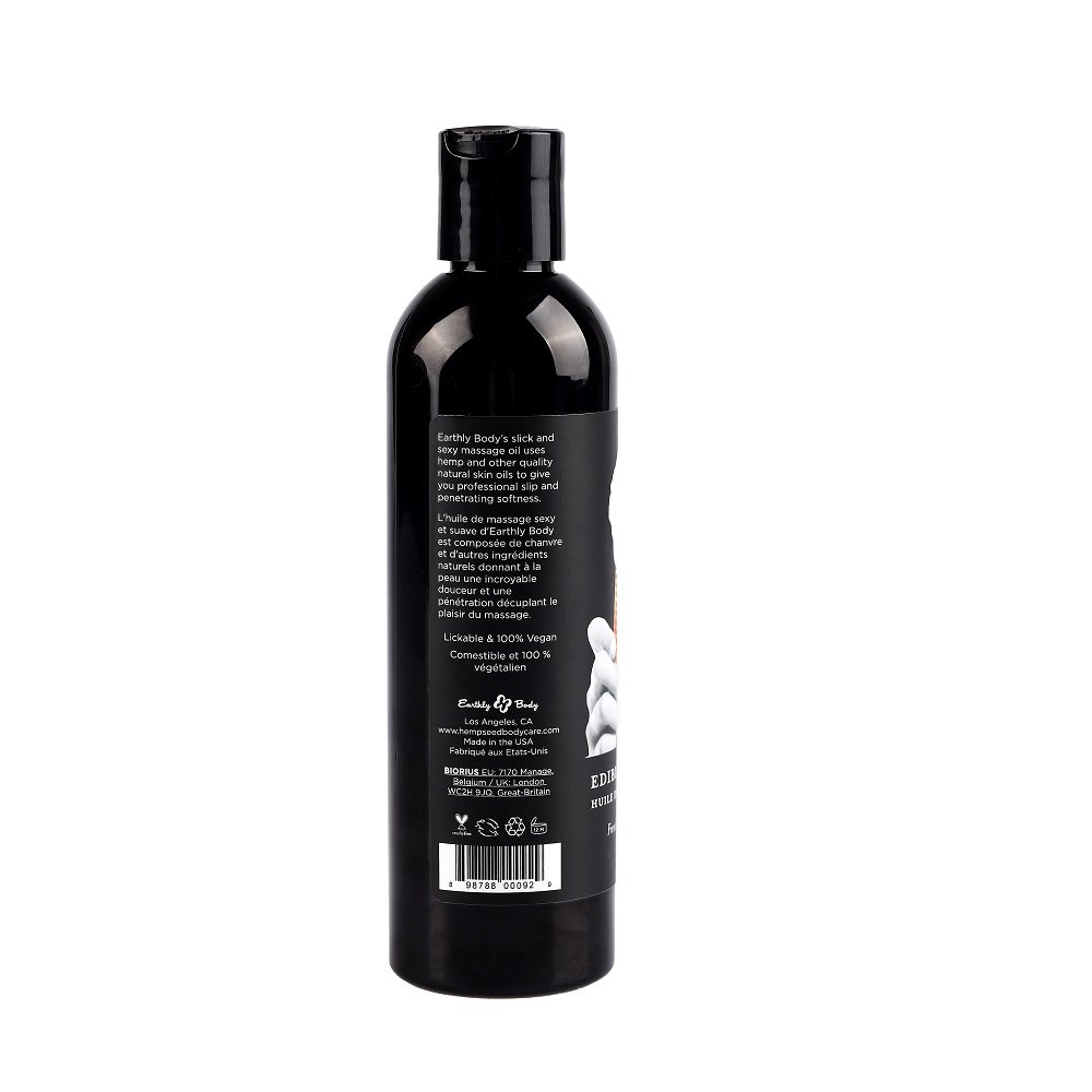 Black bottle of Earthly Body Edible Massage Oil with product information label