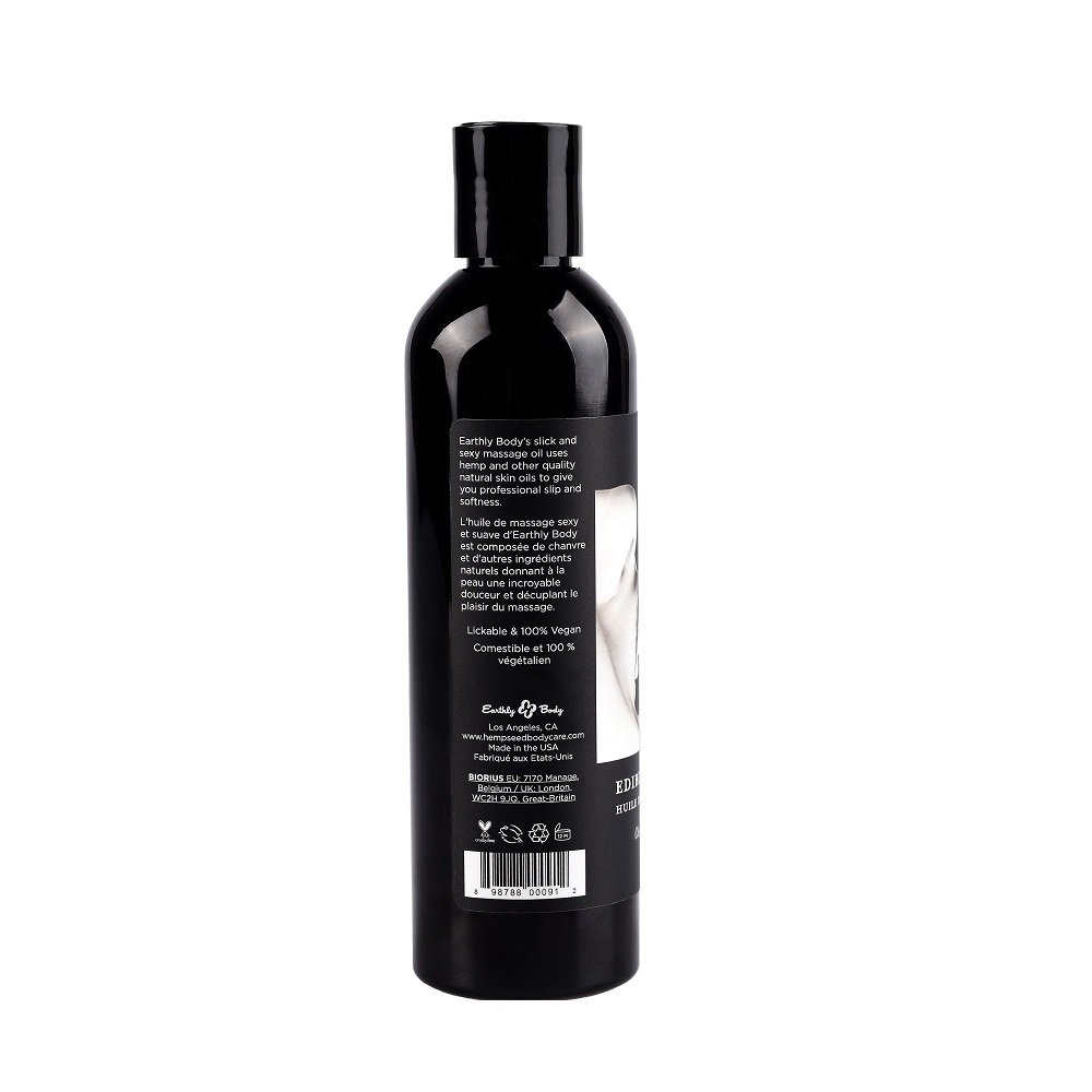 Black Earthly Body Edible Massage Oil bottle with product label and text on the back
