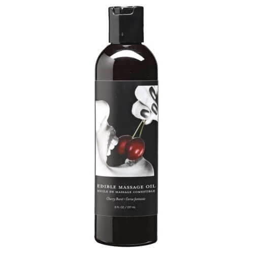 Earthly Body Edible Massage Oil bottle with black label featuring cherries and a mouth illustration