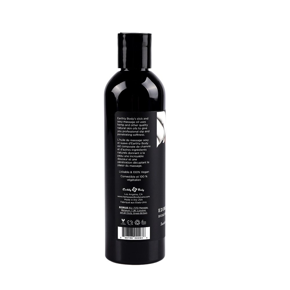Black bottle of Earthly Body Edible Massage Oil with product information and barcode on the back label